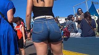 Candid view of big ass in shorts jeans