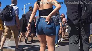 Candid view of big ass in shorts jeans