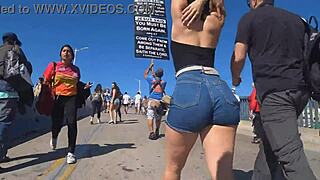 Candid view of big ass in shorts jeans