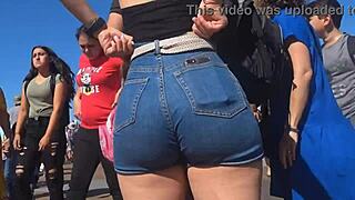 Candid view of big ass in shorts jeans