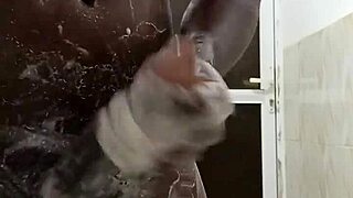 horny bottom masturbates big black cock in the shower