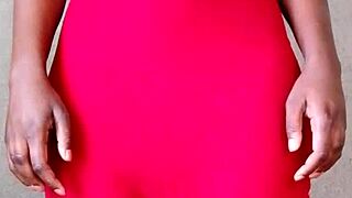 A sexy hot african lady casually shows off her tits.