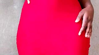 A sexy hot african lady casually shows off her tits.