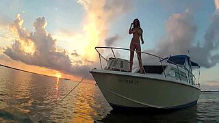 A woman flashes her tits on a boat in this public outdoor adventure