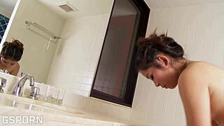 Hot Asian girl shows hairy pussy in bathroom