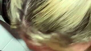 A person assists in the public restroom of a movie theater