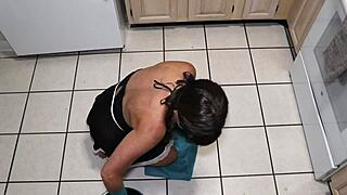 Petite milf slave gets double penetration in the kitchen