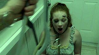 The redhead slut eagerly licks cum off her dominatrix's boot in this BDSM scene.