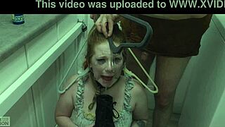 The redhead slut eagerly licks cum off her dominatrix's boot in this BDSM scene.