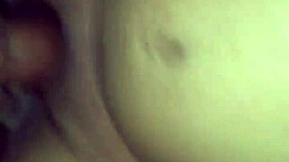 She stares into your eyes while licking her wet pussy close up.