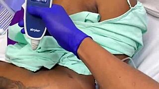 Horny doctor fucks patient, fills her tits with cum in hospital.