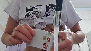 look at sexy latina maid washing dishes with huge tits fully exposed!