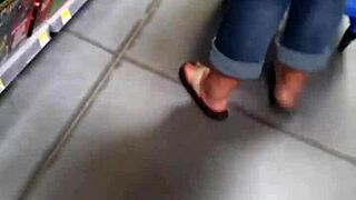 Her supersized ass strains against tight jeans