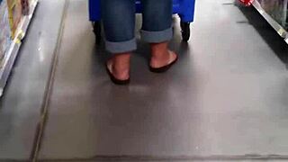 Her supersized ass strains against tight jeans