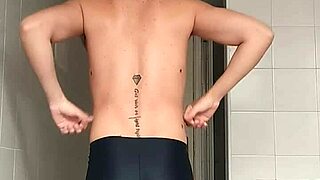 guy in black beach shorts shaves smooth in intriguing bathroom reveal