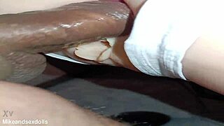 Candy slips out of white thong for teasing anal play on desk