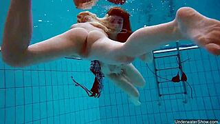 two hot lesbians dive deep for underwater pool pussy play