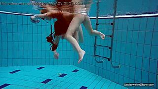 two hot lesbians dive deep for underwater pool pussy play