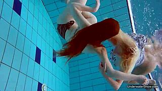 two hot lesbians dive deep for underwater pool pussy play