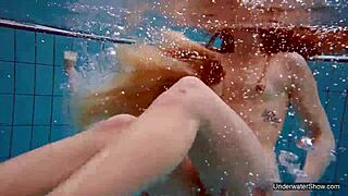 two hot lesbians dive deep for underwater pool pussy play