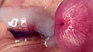 Mature cougar milf milks young stud's monster cock with handjob then takes huge facial cumshot on eyes and face