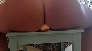 so this latina babe with huge ass grabs her dildo and sits right on it in the chair