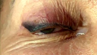 Mature cougar milf milks young stud's monster cock with handjob then takes huge facial cumshot on eyes and face