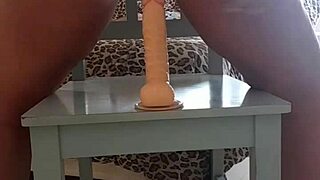 so this latina babe with huge ass grabs her dildo and sits right on it in the chair