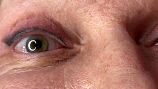 Mature cougar milf milks young stud's monster cock with handjob then takes huge facial cumshot on eyes and face