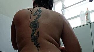 she's all wet in the bath fingerin' her fat pussy with toy deep inside