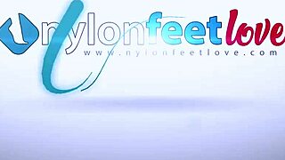 tattooed girl in pantyhose smokes cig while teasing feet