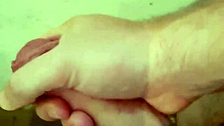 man strokes big cock to cum in steamy shower