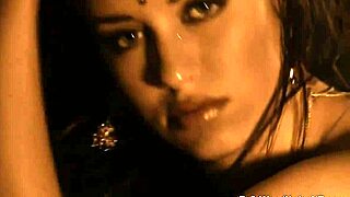 she dances naked by the fire, clothes ripped off in erotic tease