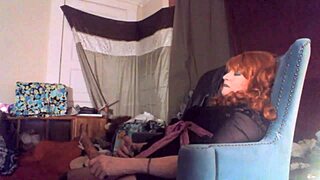 Does sexy redhead tranny masturbate by swallowing huge vibrating 8 inch dildo?
