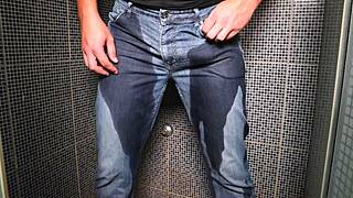 guy soaks jeans with piss then blasts huge cumshot outdoors
