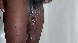 She steps into icy shower water refreshing her skin after long day