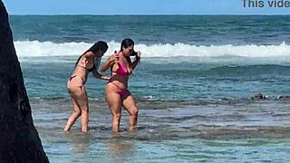 Two sexy latinas kiss and tease big asses on brazilian beach outing