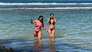Two sexy latinas kiss and tease big asses on brazilian beach outing