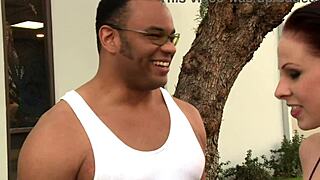 A busty white woman eagerly takes massive black cock deep inside