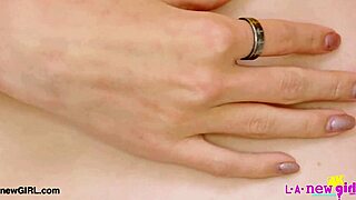 Blonde beauty poses revealing her petite figure on sofa