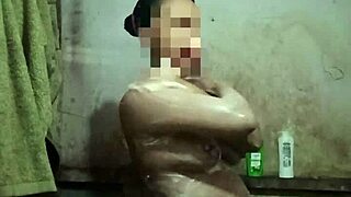 indonesian stw housewife asian with big natural tits and pussy strips naked in shower