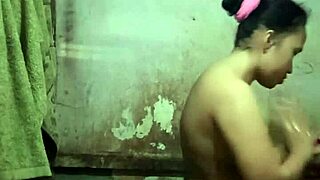 indonesian stw housewife asian with big natural tits and pussy strips naked in shower