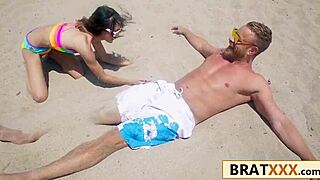 Tiny brunette hooks up at beach then rides massive cock