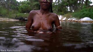 Skinny African Hottie Teases Tits in Water Softcore.