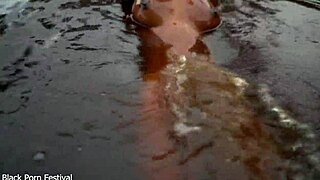 Skinny African Hottie Teases Tits in Water Softcore.