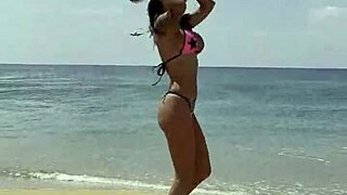 monika fox flaunts pink starry bikini along sun-kissed beach