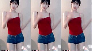 the cute chinese girl dances wildly jumping up and down shaking her small tits