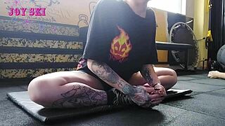 hey, check out this alternative girl stretching her sexy body at the gym