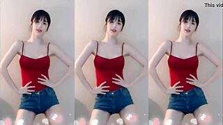 the cute chinese girl dances wildly jumping up and down shaking her small tits