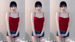 the cute chinese girl dances wildly jumping up and down shaking her small tits